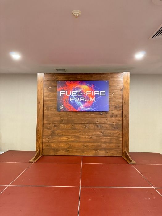 Custom-built wooden backdrop display for the Fuel and Fire Forum corporate event, designed and installed by Simply LaMayed Custom Decor.